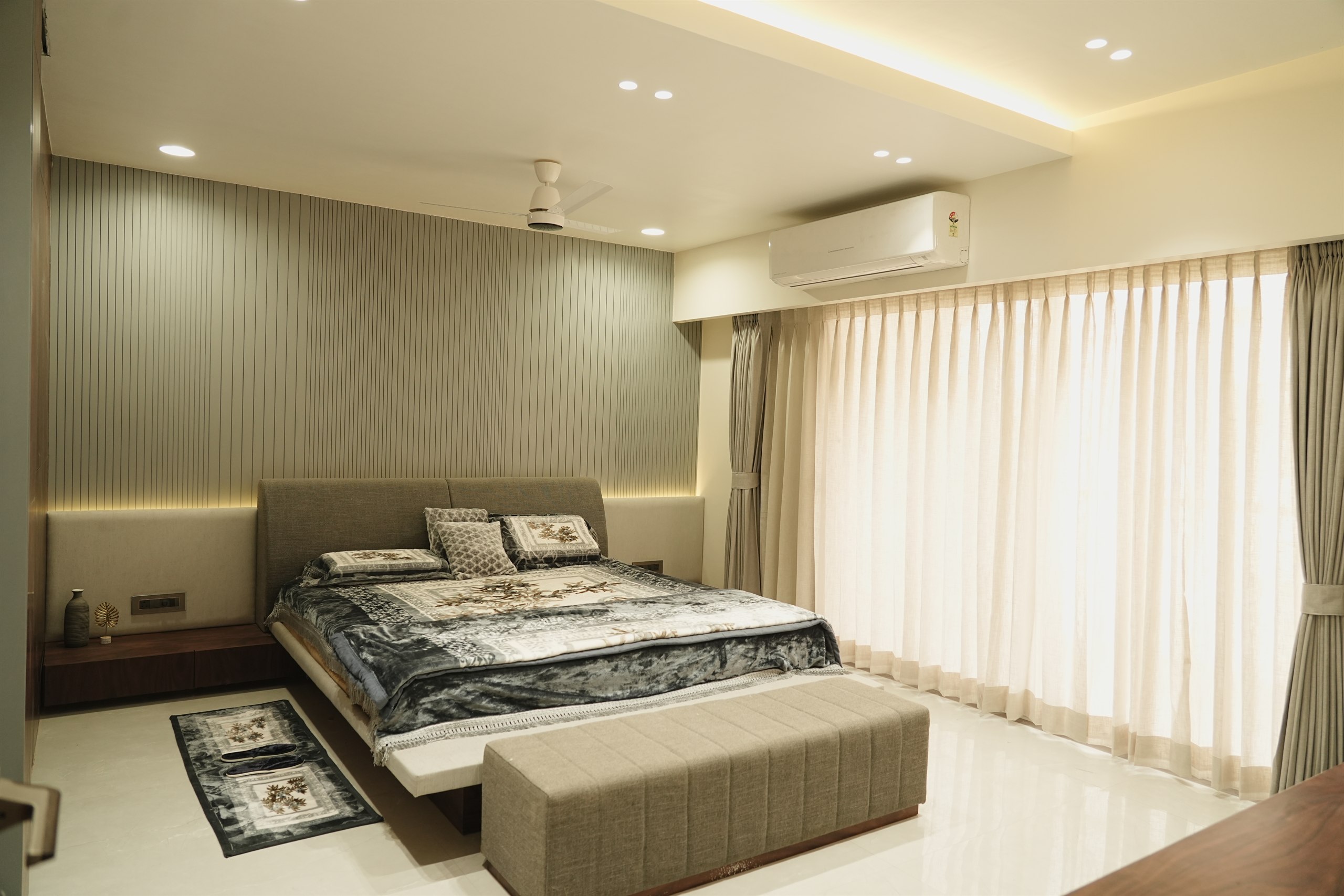 Pancholia Residence master bedroom with sheer curtains and cove lighting